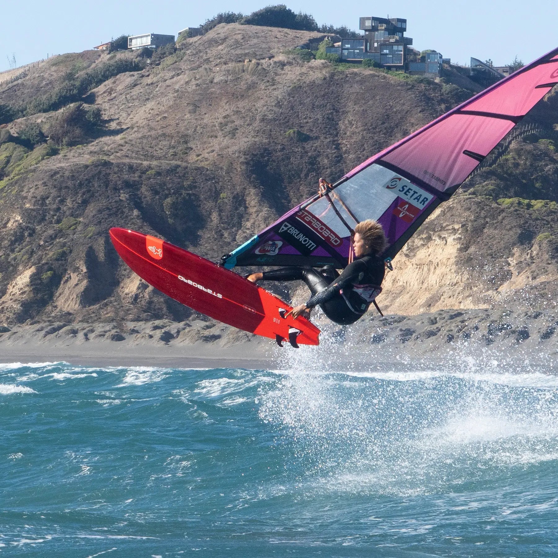 High-performance red Kode Windsurf Board with black and purple sail
