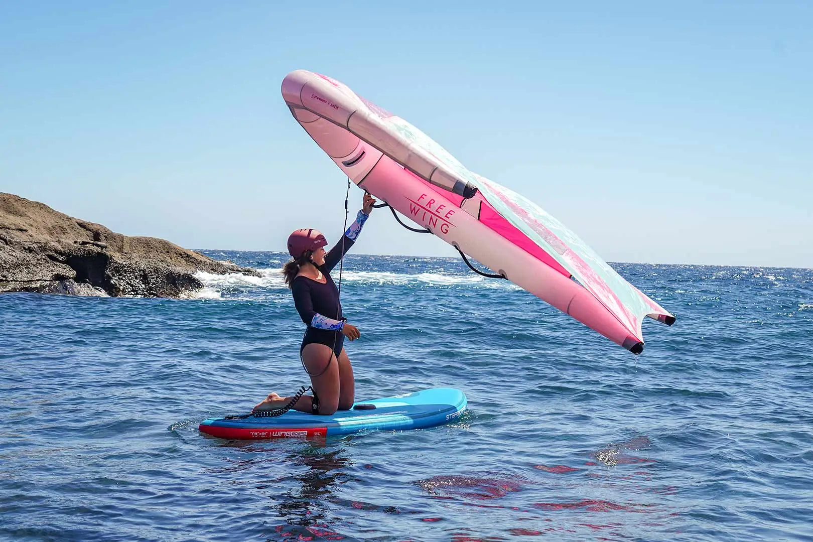Pink and white SUP learner board with black accents