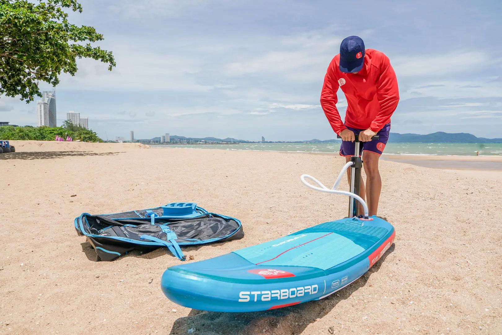 Pink and white SUP learner board with black accents