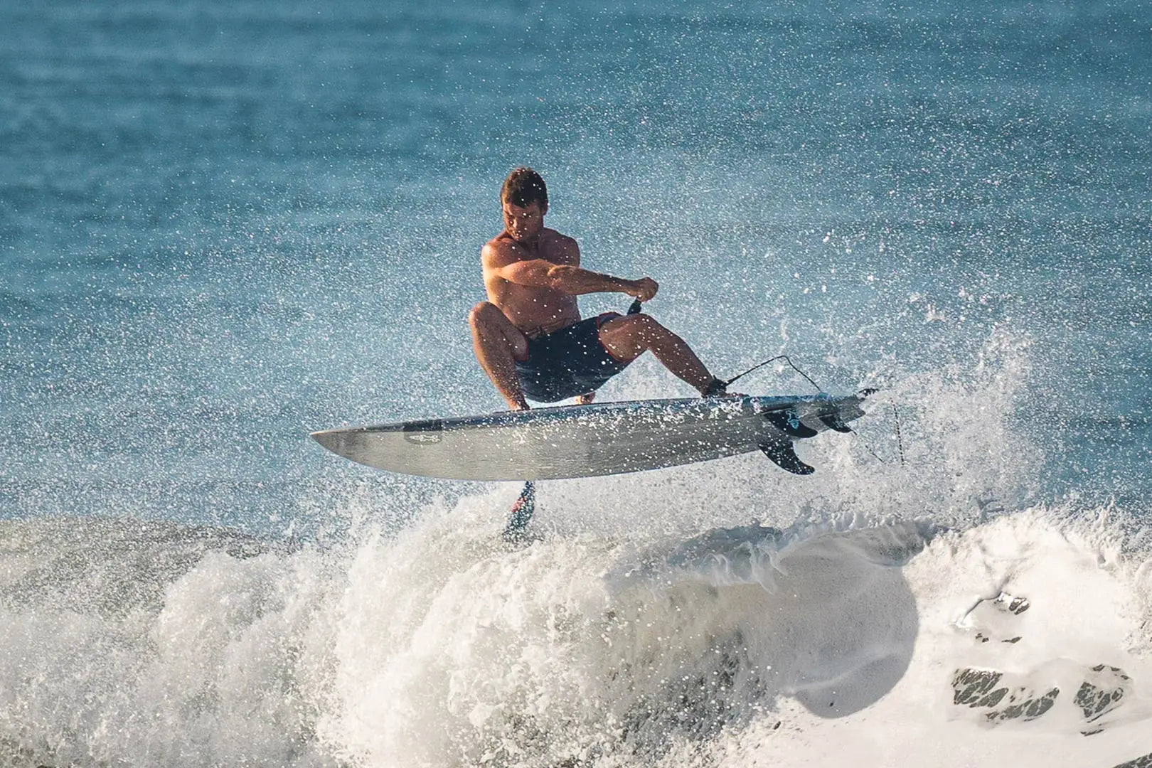 Black and white fiberglass surfboard in Prepreg Carbon SUP Fins collection