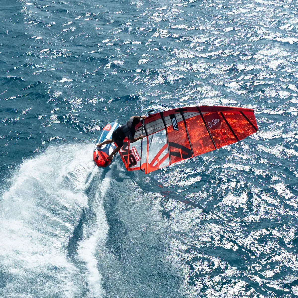 Red and white Foil windsurfing board with sleek Race Windsurf design