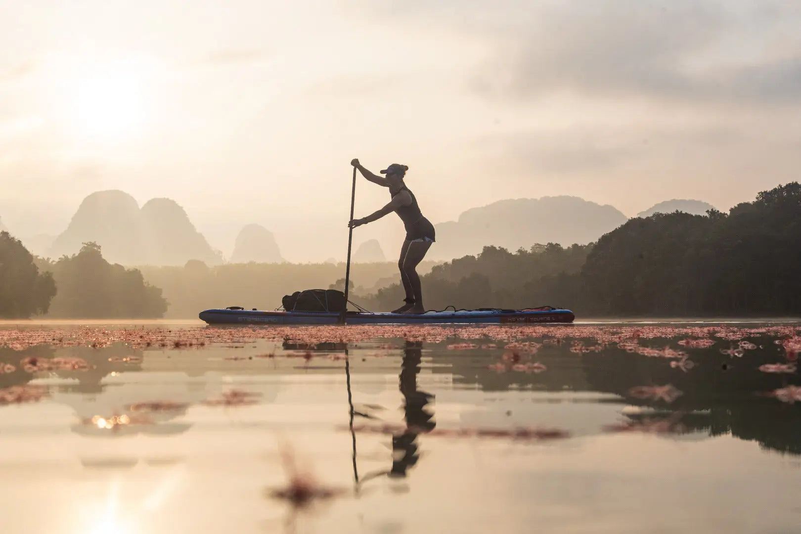 Sleek touring inflatable paddleboard with vibrant pink flowers