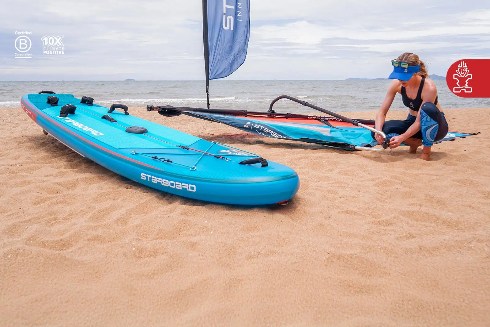 Blue inflatable kayak with red trim and black accents in Waterman Package