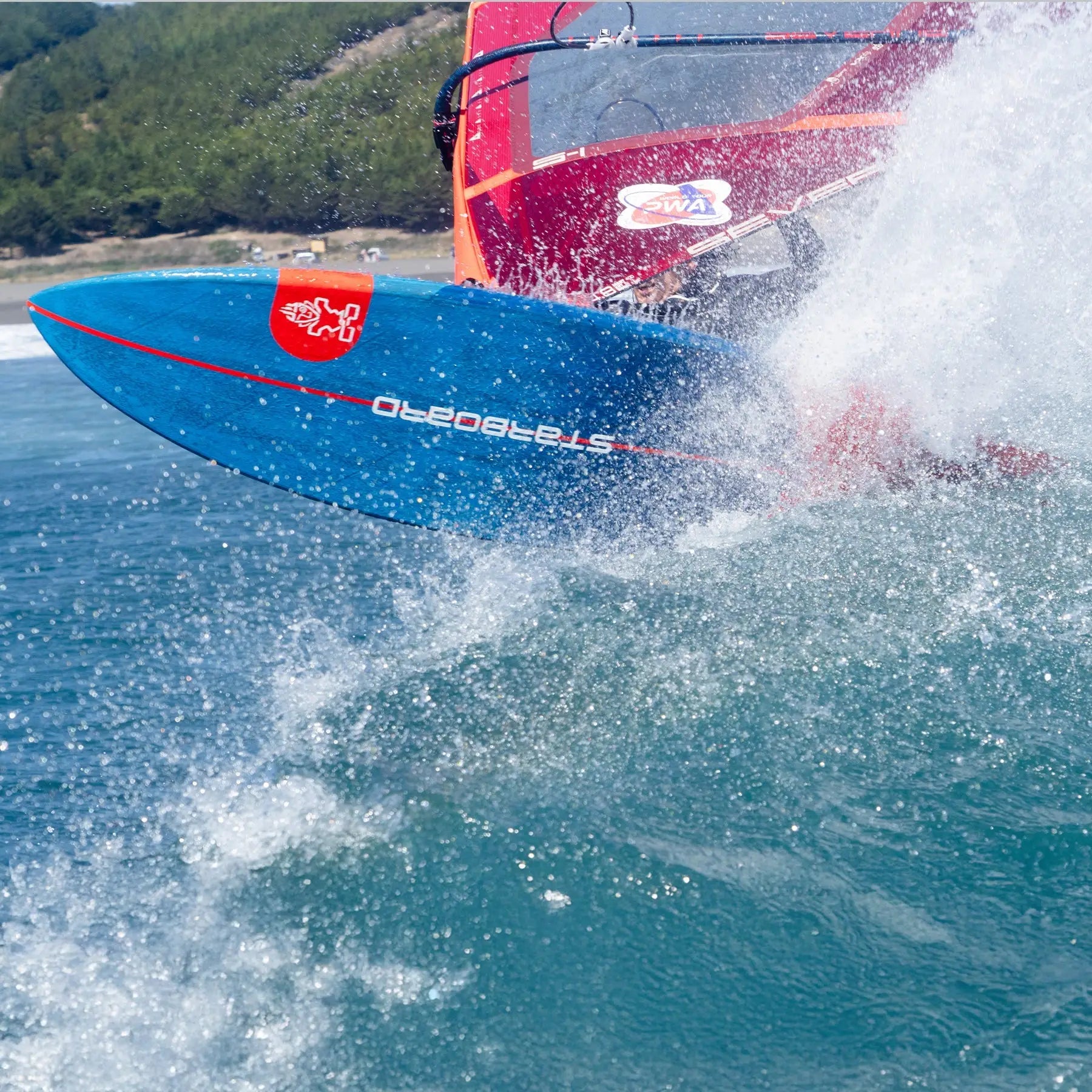 Blue and orange high-performance windsurfing board with red logo in Wave Windsurf collection