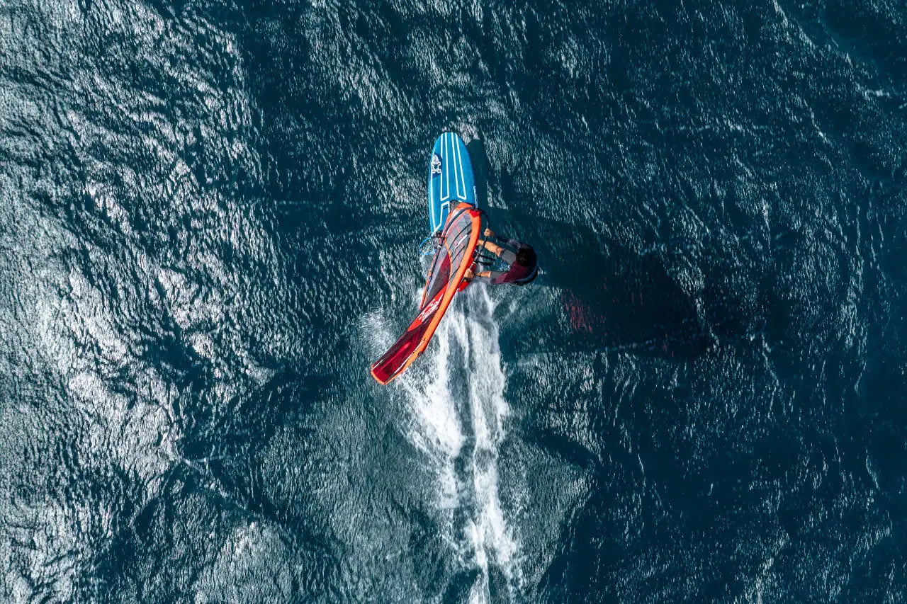 Sleek blue and red kiteboarding board in Windsurf Boards collection