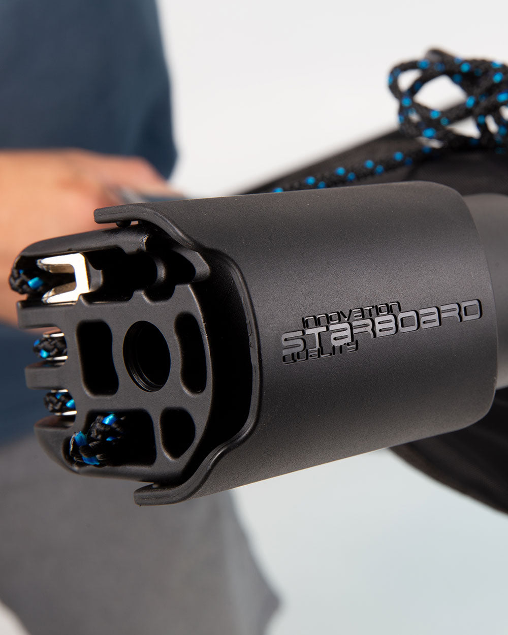 Black starboard ski handle with blue accents, textured grip, no mast base