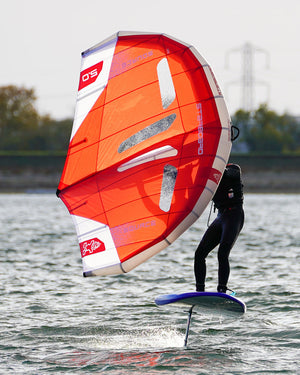 Source Wing vibrant orange and white windsurfing sail with black accents