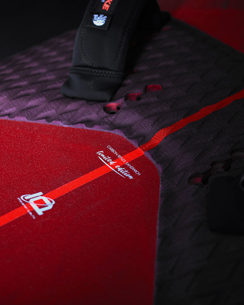 Red and black iGnite Air Windfoil Board yoga mat with white logo and grip texture