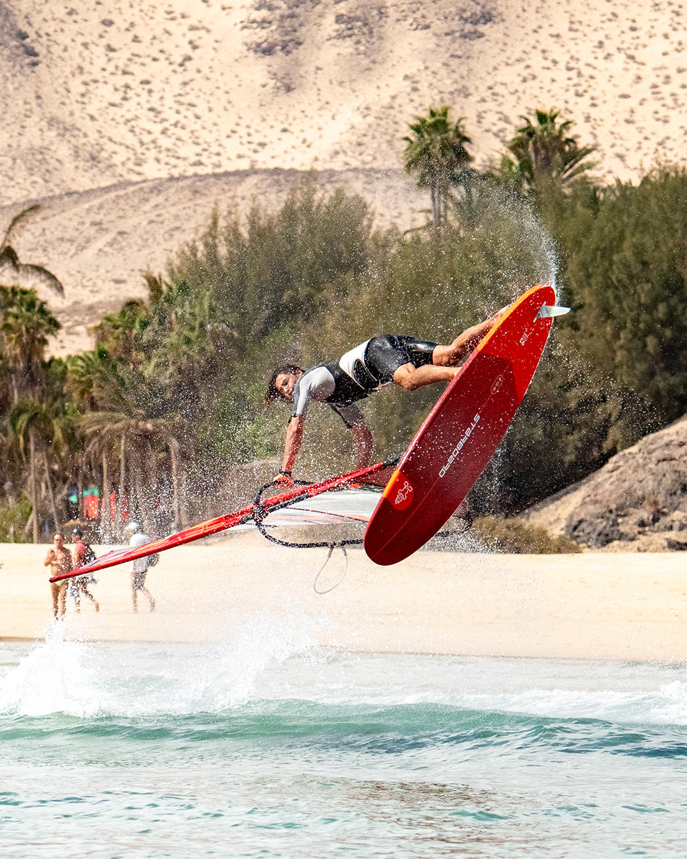 IGnite Windsurf Board: red carbon fiber with black and white design