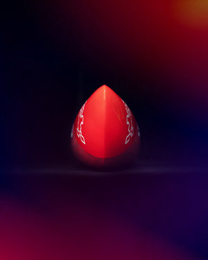 Red triangular prism die with white symbols on All Star Paddleboard