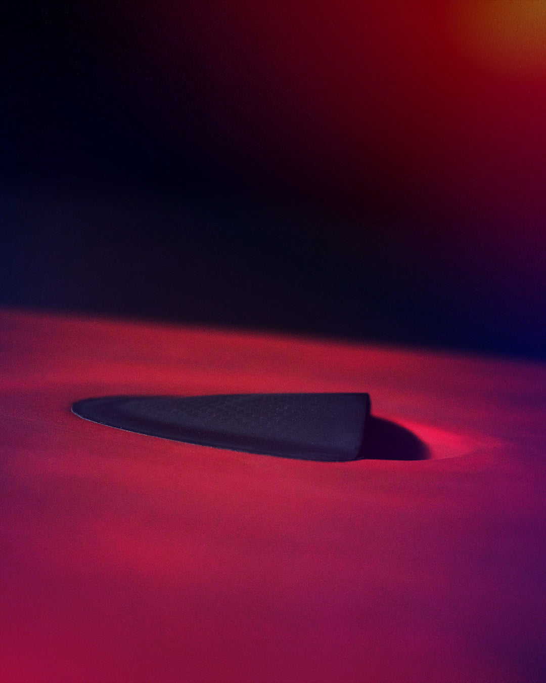 Black paper airplane with red glow in NEW All Star Paddleboard