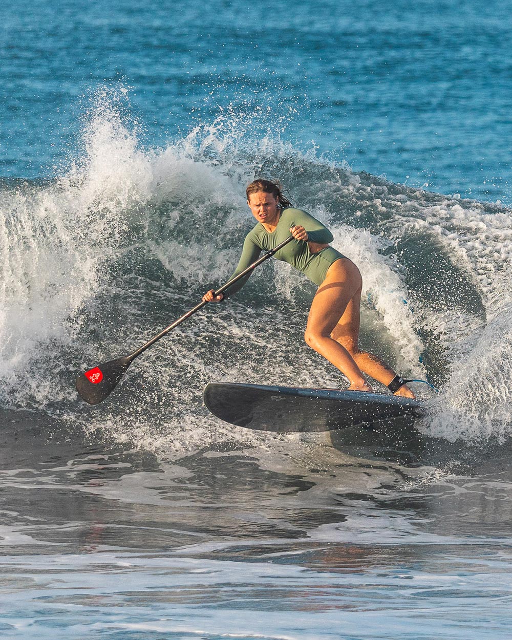 Enduro Prepreg Carbon Paddle stand-up paddleboard with red tip, black deck, white rails