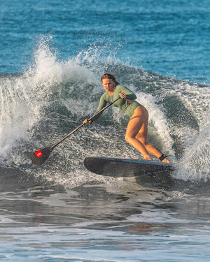 Enduro Prepreg Carbon Paddle stand-up paddleboard with red tip, black deck, white rails