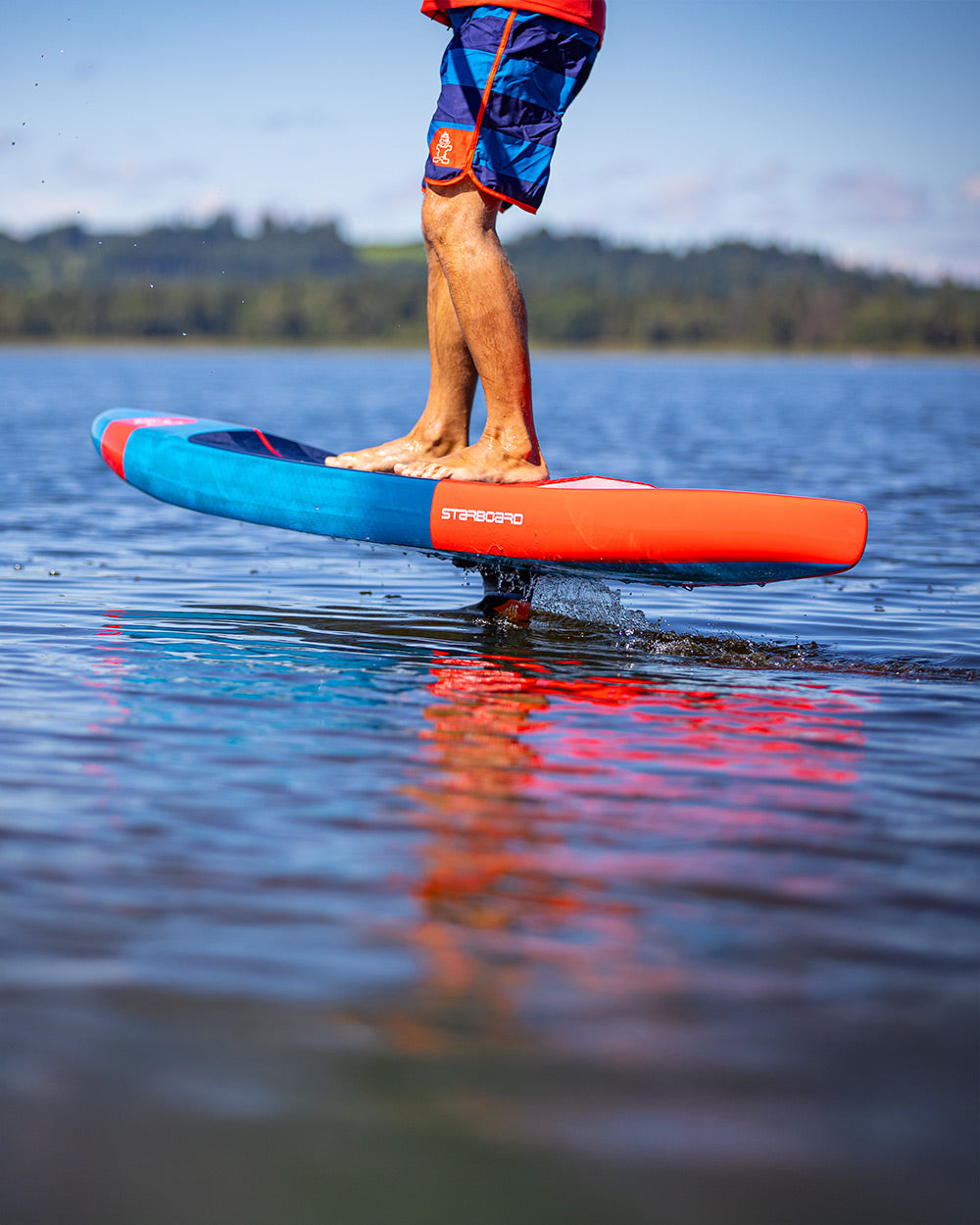 Sleek blue and orange Ace Foil Lightning hydrofoil board for downwind performance