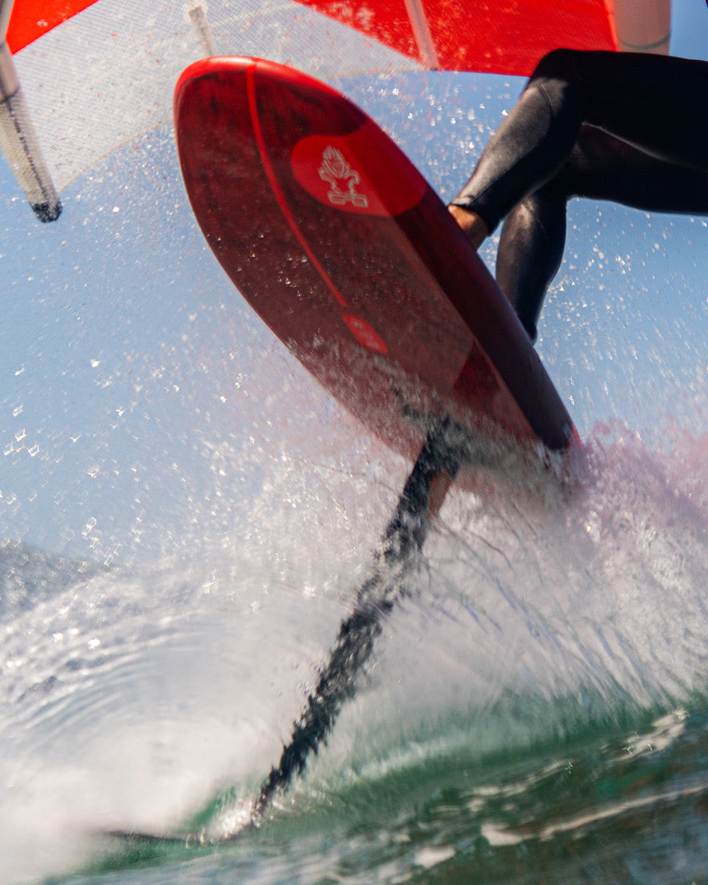 Red iGnite Wing Foilboard: hydrofoil with black fins and white logo