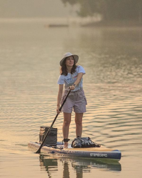 Vibrant blue Touring Paddleboard with sleek design and foam padding