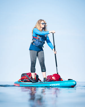 Blue Touring Inflatable Paddleboard with Paddle, Red Bags, Black Accents