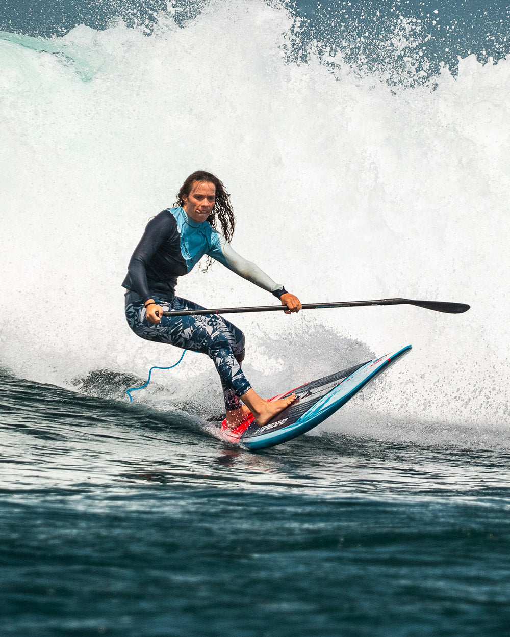 Blue and white Longboard SUP surfboard with black leash