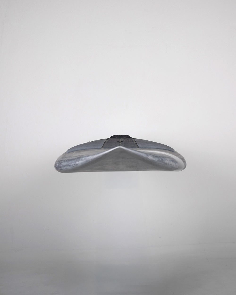 Silver metallic stealth bomber model airplane toy in Pro Paddleboard