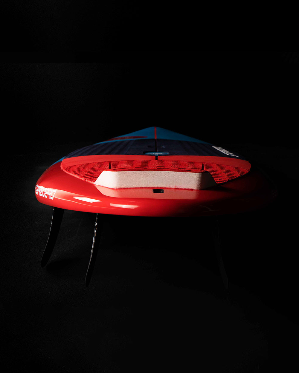 Red and blue 2025 Spice inflatable paddleboard with white accents