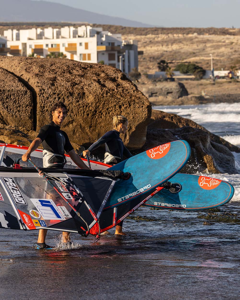 2025 iGNiTE Windsurf Board with red white design black fins blue leash