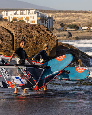 2025 iGNiTE Windsurf Board with red white design black fins blue leash