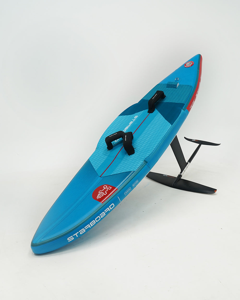 Blue and red Starboard Ace Air Foil inflatable hydrofoil surfboard with black fins