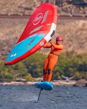 Red and blue Above Air Foil inflatable foilboard with orange suit